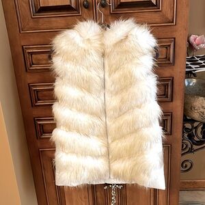 Real fur vest white with some tan tips. New never worn. Really pretty!